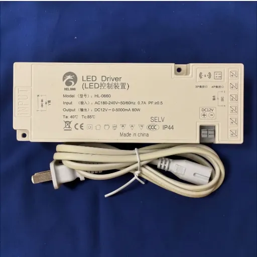 [HL-0660 HelongLED Driver（LED控制装置）Model（型号）：HL-0660Input: AC180-240V~50/60Hz 0.7A .PF:20.5Output : DC12V NO:C- 0-5000mA 60WTa: 40°C Tc:85°CCE SELV IP44] باور سبلاي 12 فولت دريسينج روم  60 وات