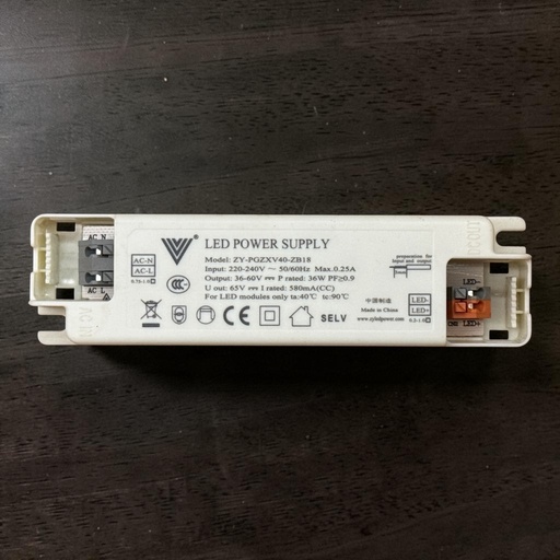 [Model: ZY-PGZXV40-ZB18
LED POWER SUPPLY
Input: 220-240V ~ 50/60Hz Max.0.25A
Output: 36-60V = P rated: 36W PF20.9
U out: 65V mm I rated: 580mA(CC)
For LED modules only ta:40°C tc:90°C
CE SELV
中国制透
Made in China www.zyledpower.com] LED Driver (Plastic Case) — 36W, 580mA