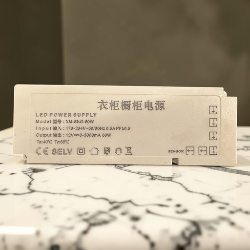 [衣柜橱柜电源 Model: XM-SKG-60W
LED POWER SUPPLY
Input : 176-264V~50/60Hz 0.5A PF≥0.5
Output: 12V=0-5000mA 60W
Ta:40°C Te:85°C
CE SELV SENSOR] Power Supply — 60W, 12V, Dressing Room (PD1209)